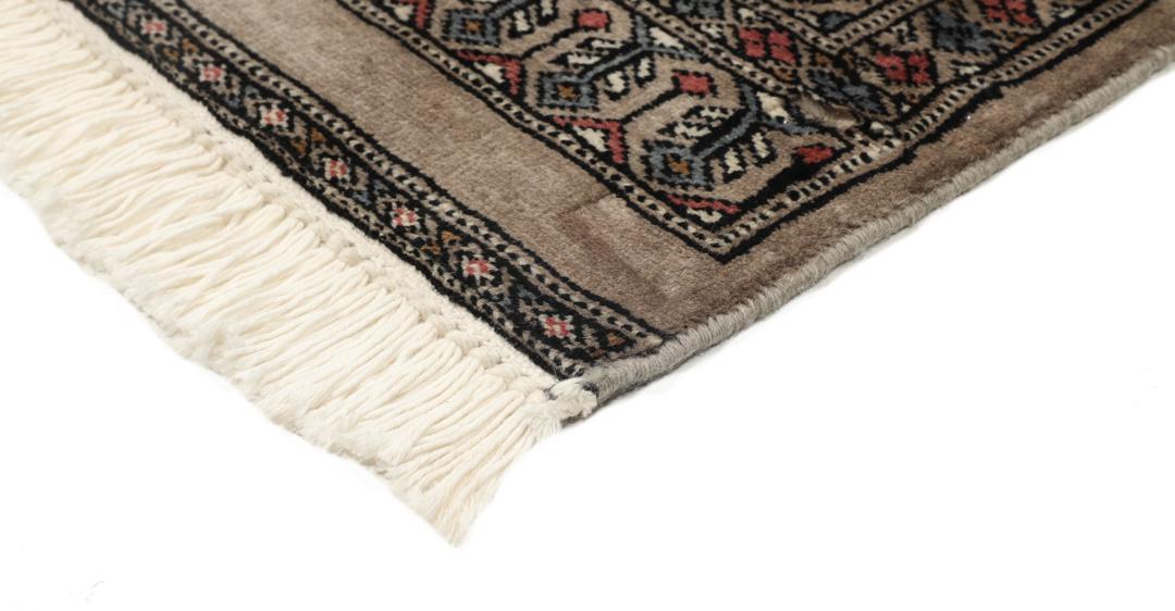 Hand-knotted Pakistan Bokhara rug with a red and beige geometric pattern