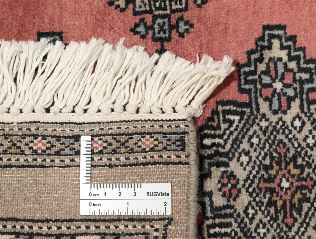 Hand-knotted Pakistan Bokhara rug with a red and beige geometric pattern