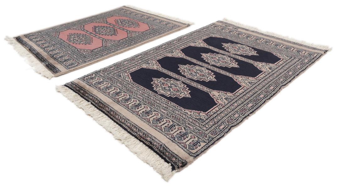 Hand-knotted rug from Pakistan with dark-blue and pink detailing