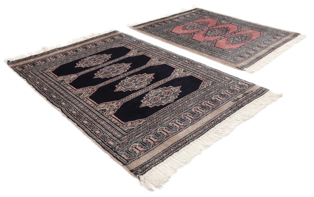Hand-knotted rug from Pakistan with dark-blue and pink detailing