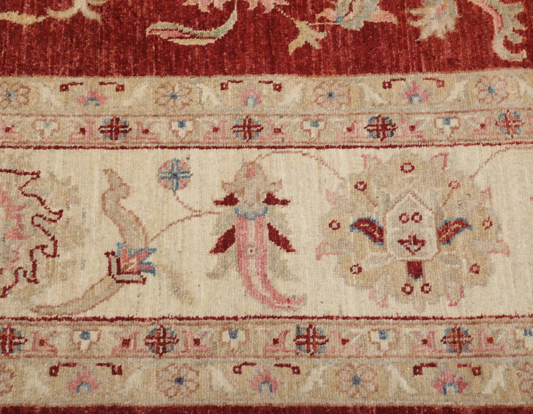 Hand-knotted Afghan rug with floral motifs in dark-red and beige