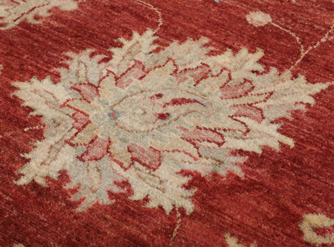 Hand-knotted Afghan rug with floral motifs in dark-red and beige