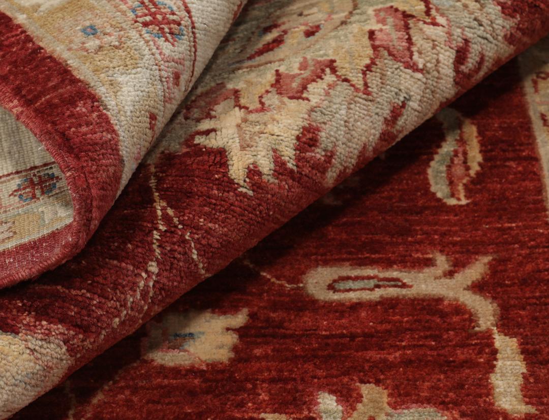Hand-knotted Afghan rug with floral motifs in dark-red and beige
