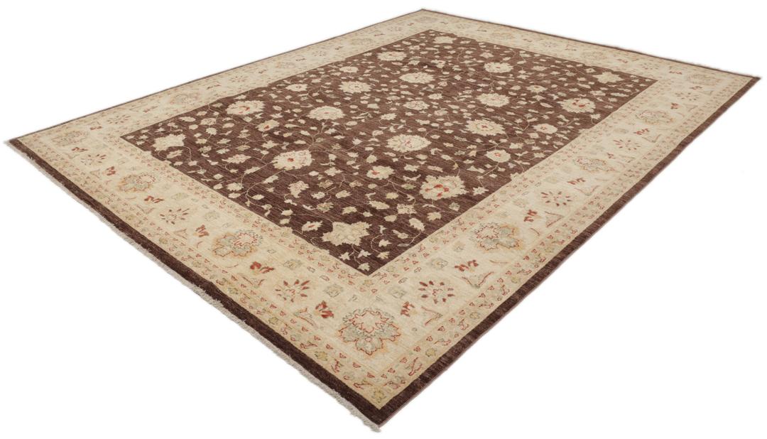 A hand-knotted Afghan rug with a dark brown field and ornate floral patterns.