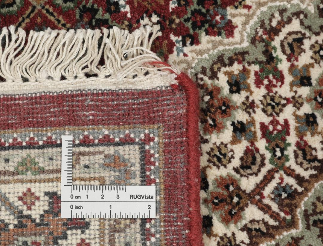 Ręcznie wiązany dywan Tabriz Royal z Indii w kolorach ciemnoczerwonym i beżowym.