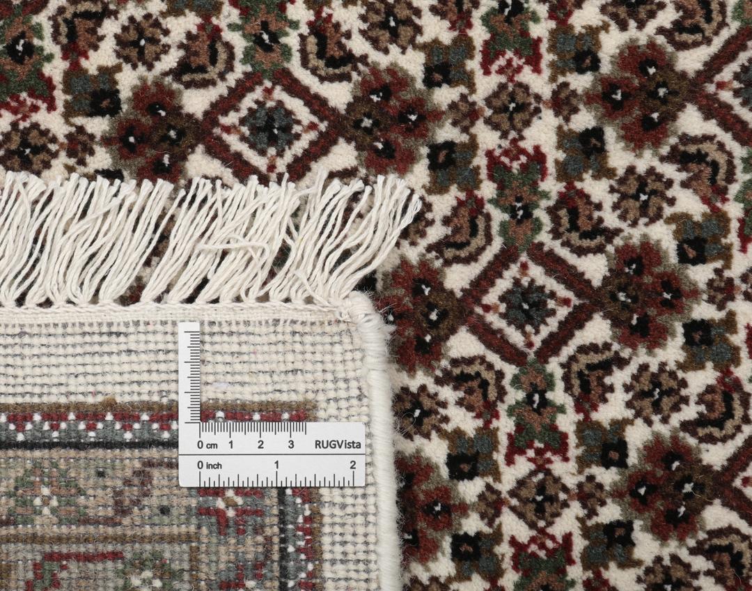 Ręcznie wiązany dywan Tabriz z Indii z brązowo-kremowym wzorem medalionu.