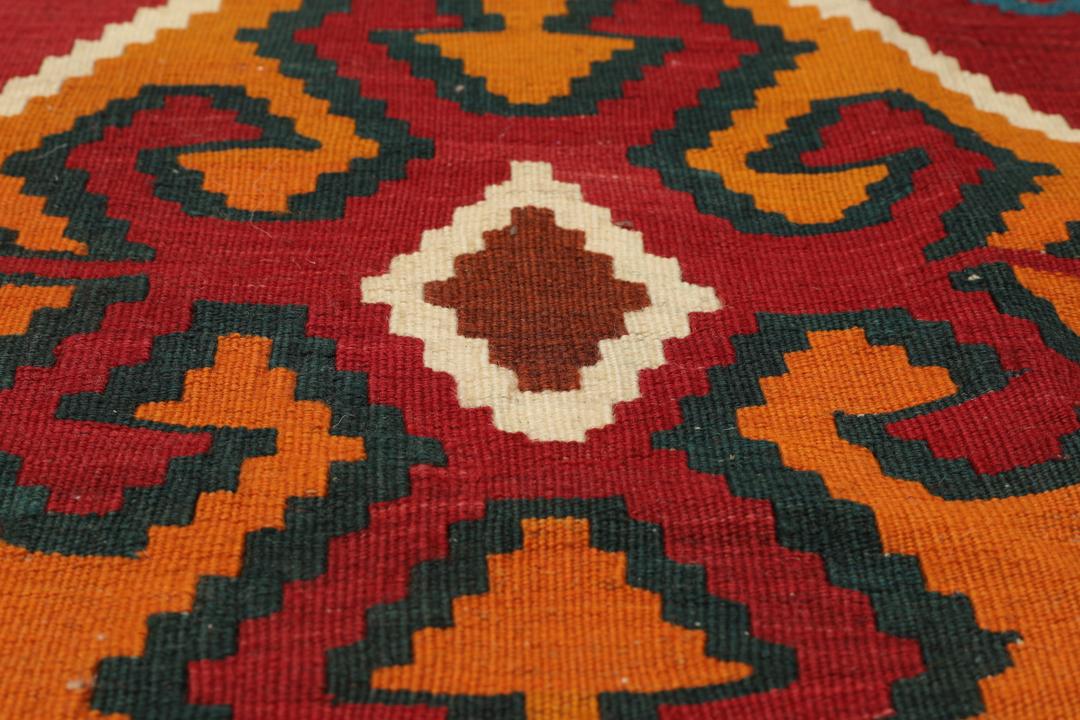 Handgeweven vintage kelim uit het Midden-Oosten in levendig rood met geometrische patronen