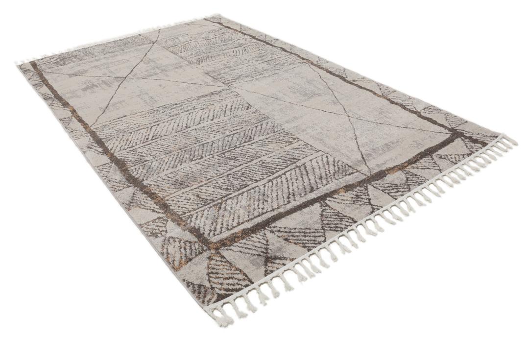 Beige en taupe vloerkleed met geometrische patronen