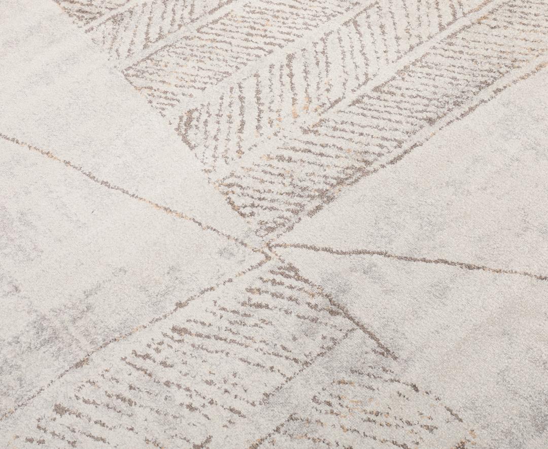 Beige en taupe vloerkleed met geometrische patronen