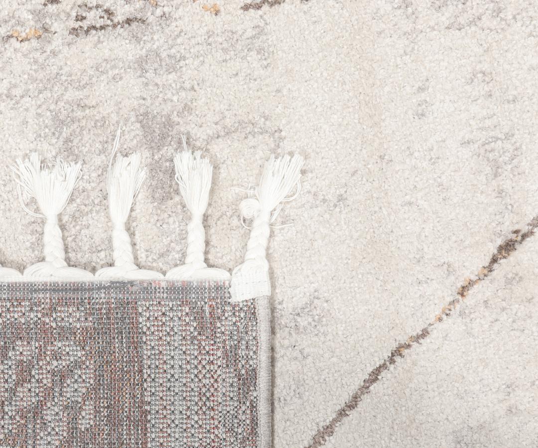Beige en taupe vloerkleed met geometrische patronen