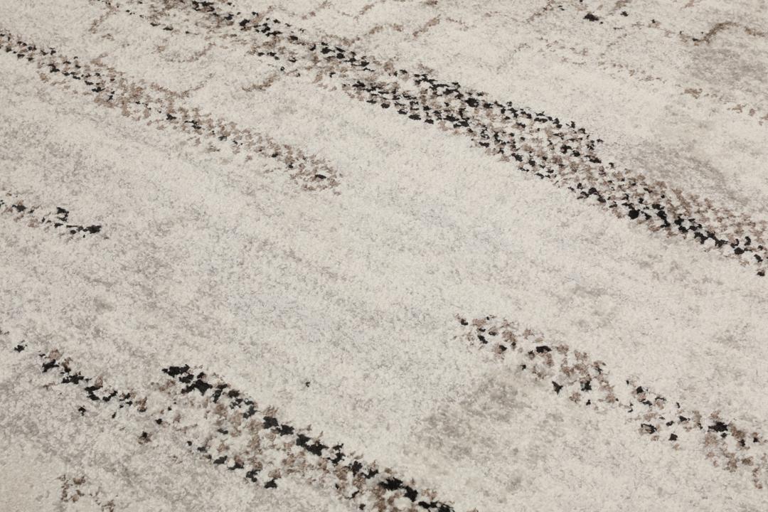 Grijs tapijt met een subtiel textuurpatroon