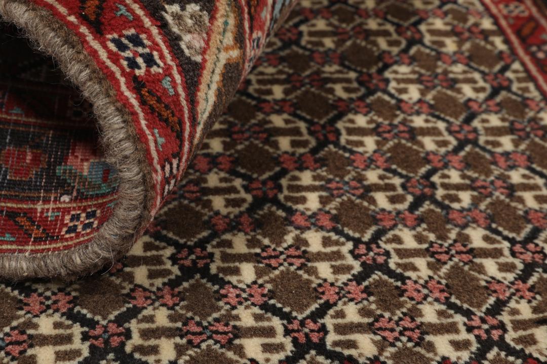 Hand-knotted Koliai rug from the Middle East with a multicolor geometric pattern