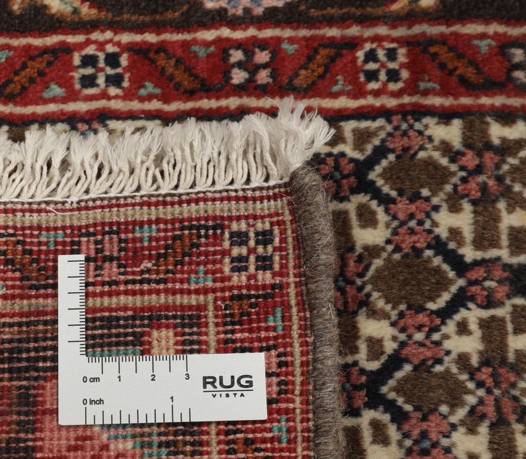 Hand-knotted Koliai rug from the Middle East with a multicolor geometric pattern