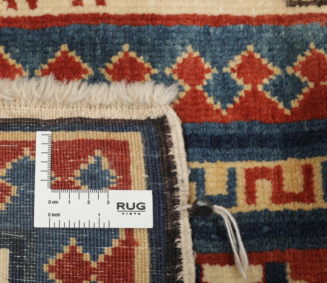 Handgeknoopte Turkse loper met diepblauwe en rode geometrische motieven