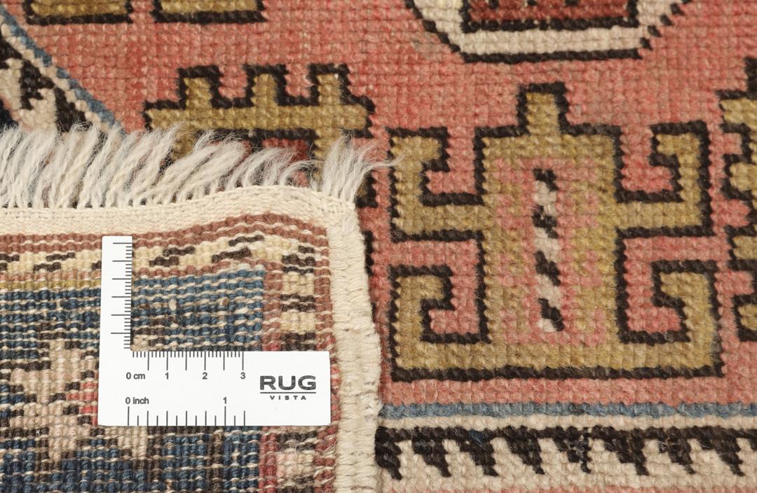 Antiek Kuba-tapijt uit Azerbeidzjan met geometrische medaillons in een donker veld