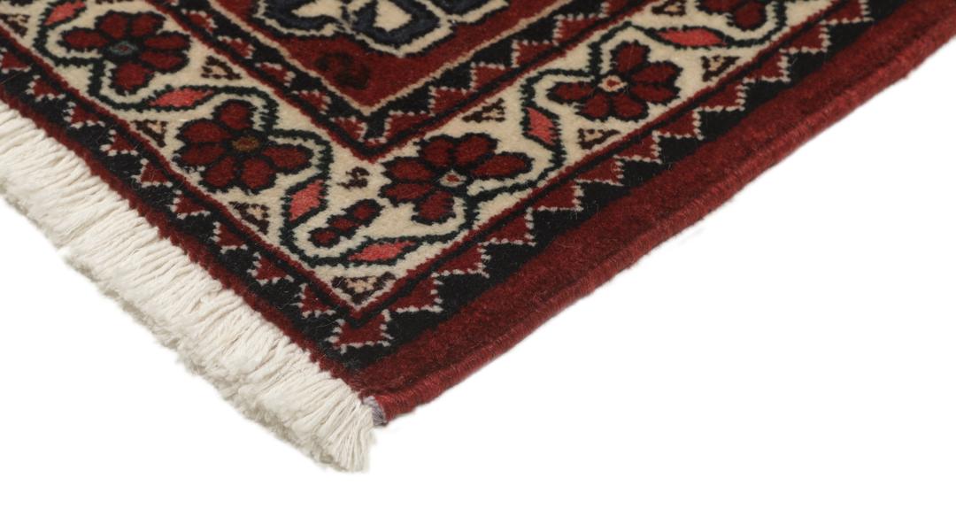 Håndknyttet Abadeh-løber fra Mellemøsten i dybe røde og beige nuancer.