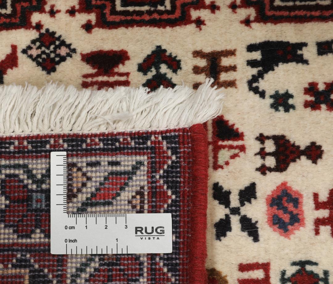 Håndknyttet Abadeh-løber fra Mellemøsten i dybe røde og beige nuancer.