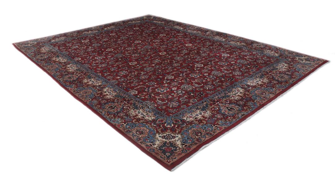 Hand-knotted Mashad rug from the Middle East in dark-red with floral pattern