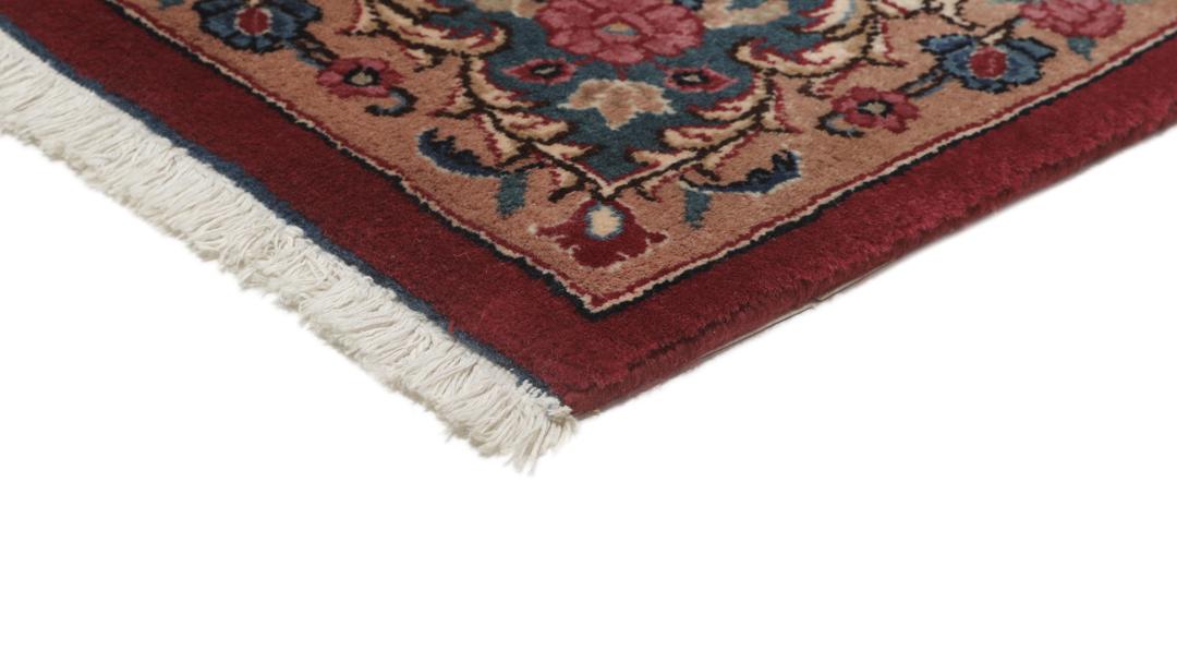 Hand-knotted Mashad rug from the Middle East in dark-red with floral pattern
