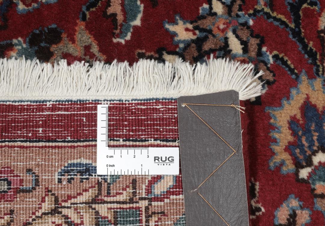 Hand-knotted Mashad rug from the Middle East in dark-red with floral pattern