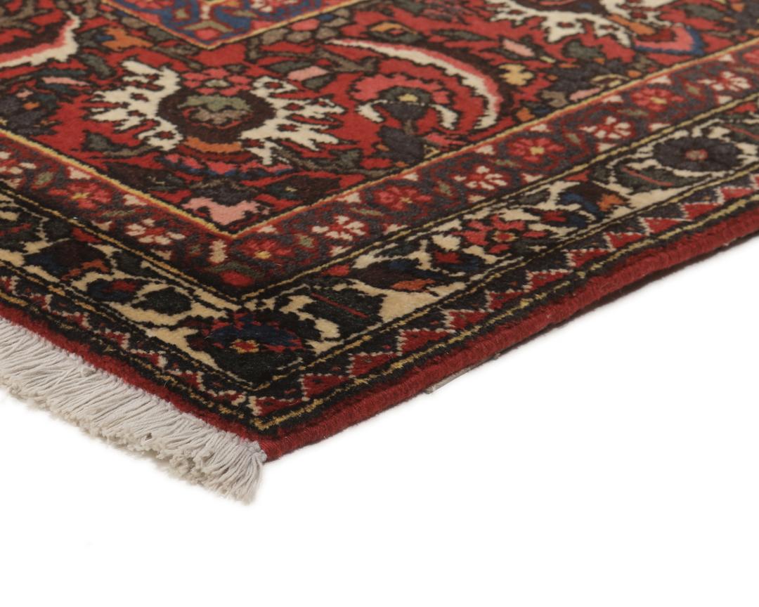 Hand-knotted Bakhtiar rug from the Middle East in deep red and multi-tonal shades