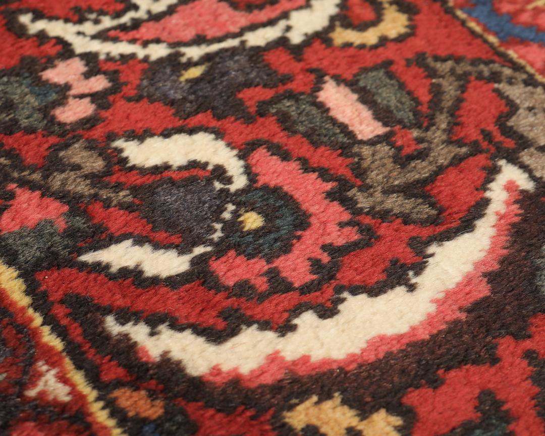 Hand-knotted Bakhtiar rug from the Middle East in deep red and multi-tonal shades