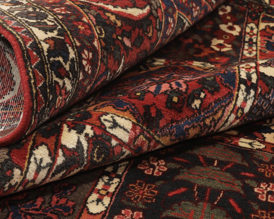 Hand-knotted Bakhtiar rug from the Middle East in deep red and multi-tonal shades