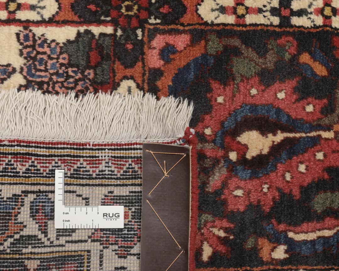 Hand-knotted Bakhtiar rug from the Middle East in deep red and multi-tonal shades