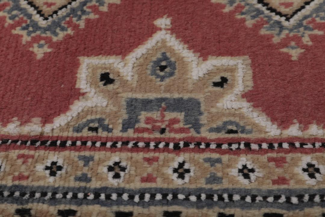 Hand-knotted Pakistan Bokhara 2ply rug with a dark-red field and geometric patterns