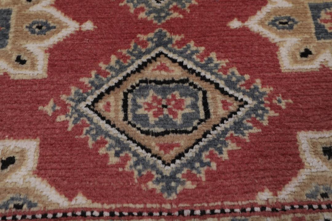 Hand-knotted Pakistan Bokhara 2ply rug with a dark-red field and geometric patterns