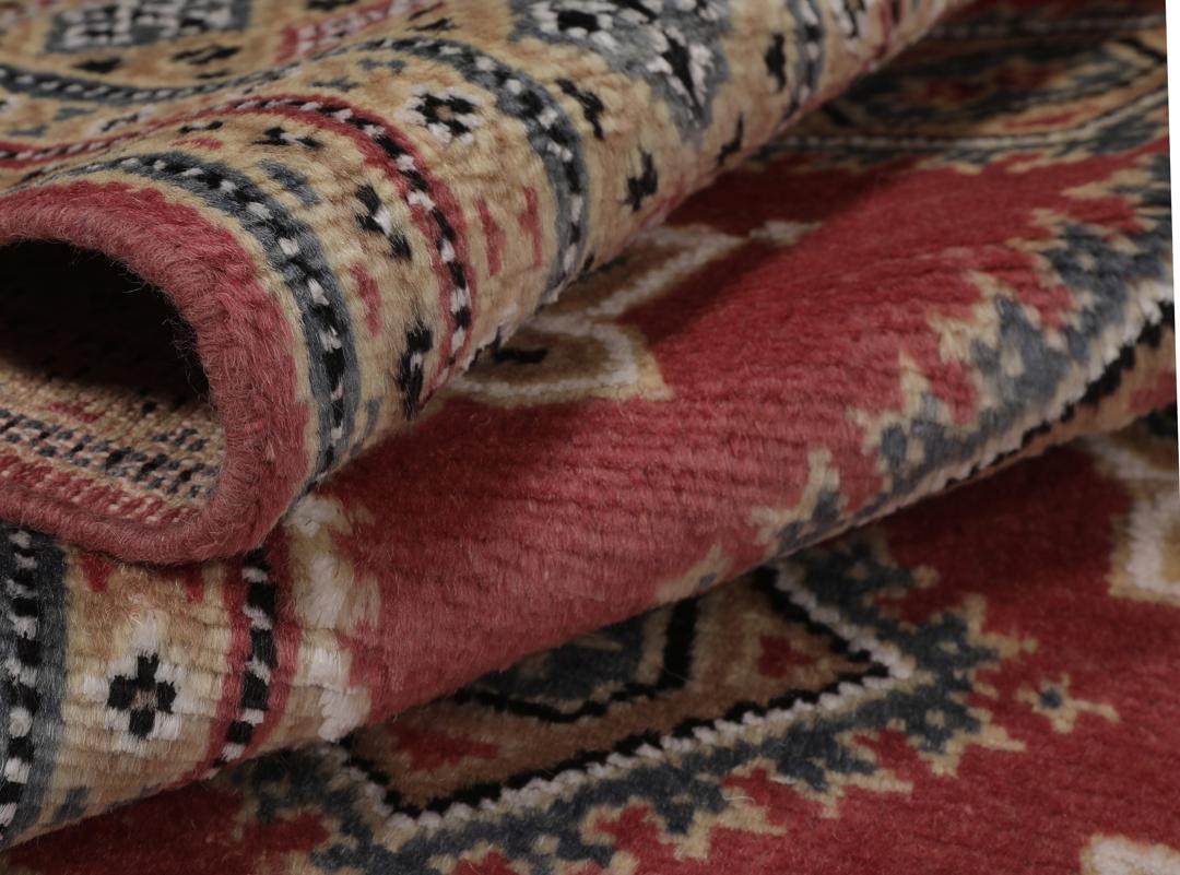 Hand-knotted Pakistan Bokhara 2ply rug with a dark-red field and geometric patterns