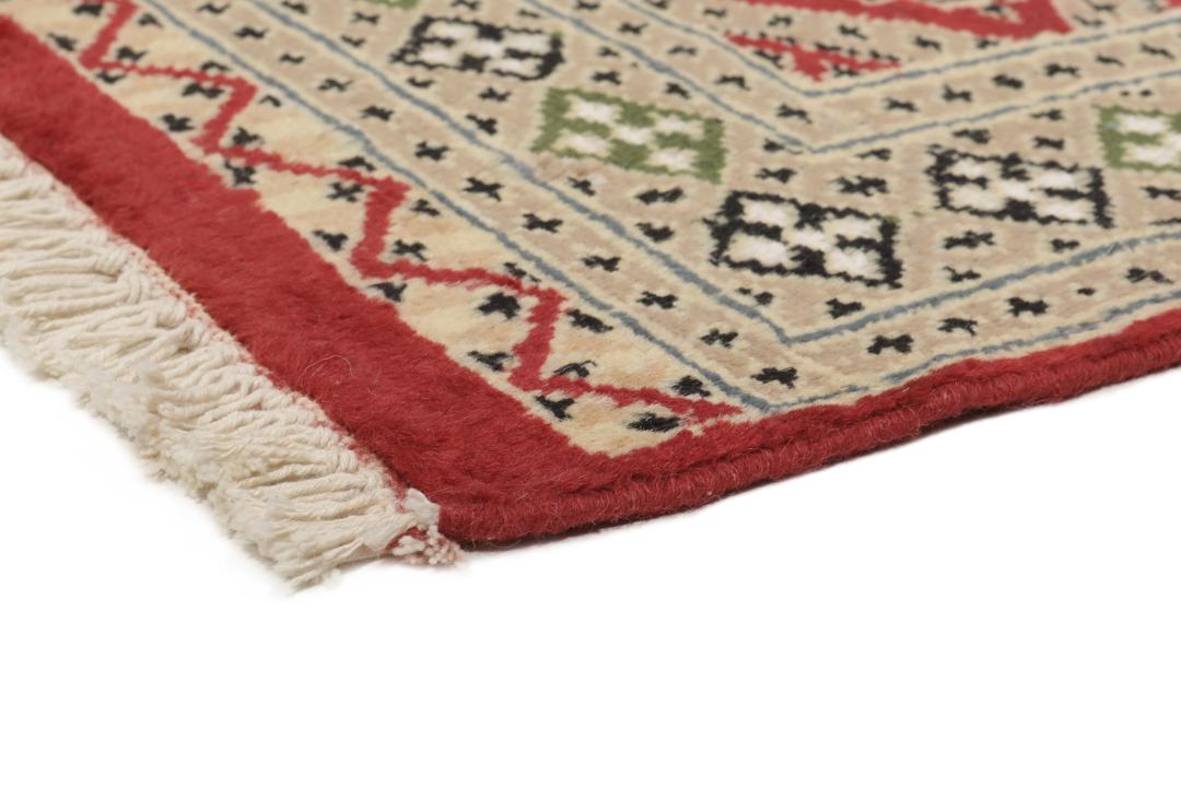 Hand-knotted Pakistan Bokhara 2ply rug with a rich red and beige colour palette
