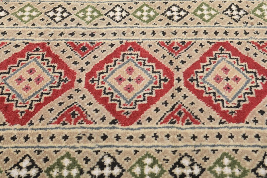 Hand-knotted Pakistan Bokhara 2ply rug with a rich red and beige colour palette