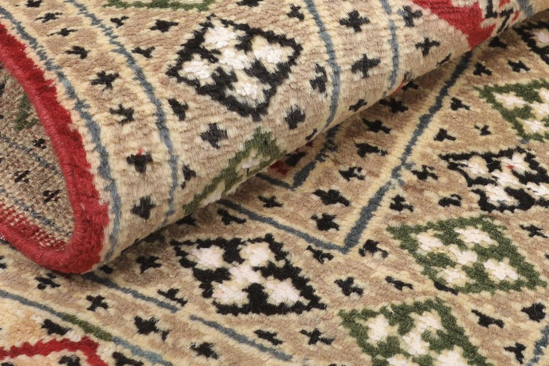 Hand-knotted Pakistan Bokhara 2ply rug with a rich red and beige colour palette