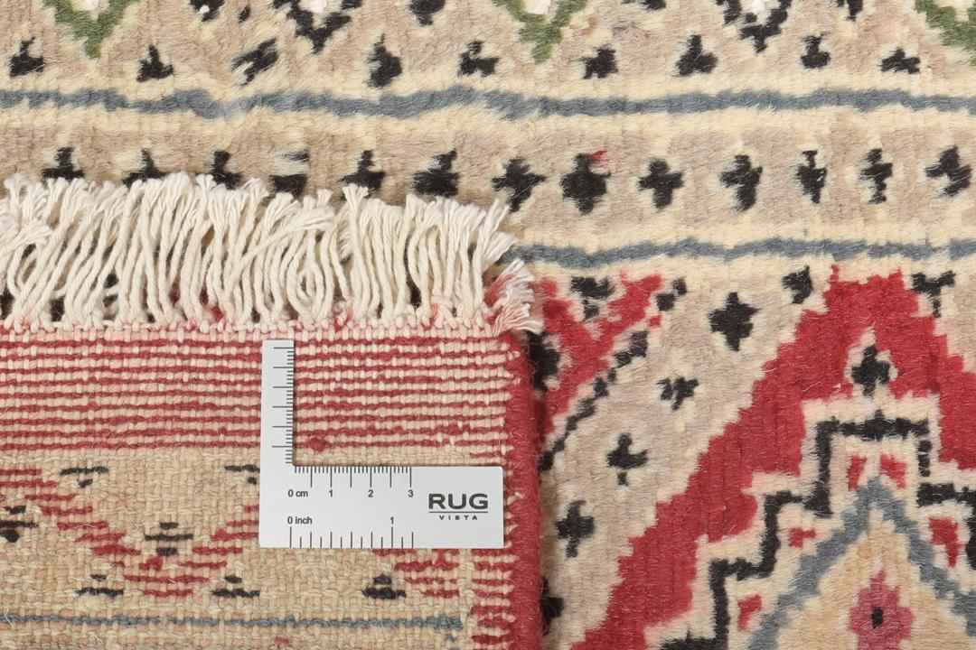 Hand-knotted Pakistan Bokhara 2ply rug with a rich red and beige colour palette