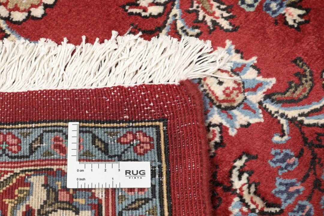 Håndknyttet Hamadan Shahrbaf-tæppe med en central blomstermedaljon i rød og blå.