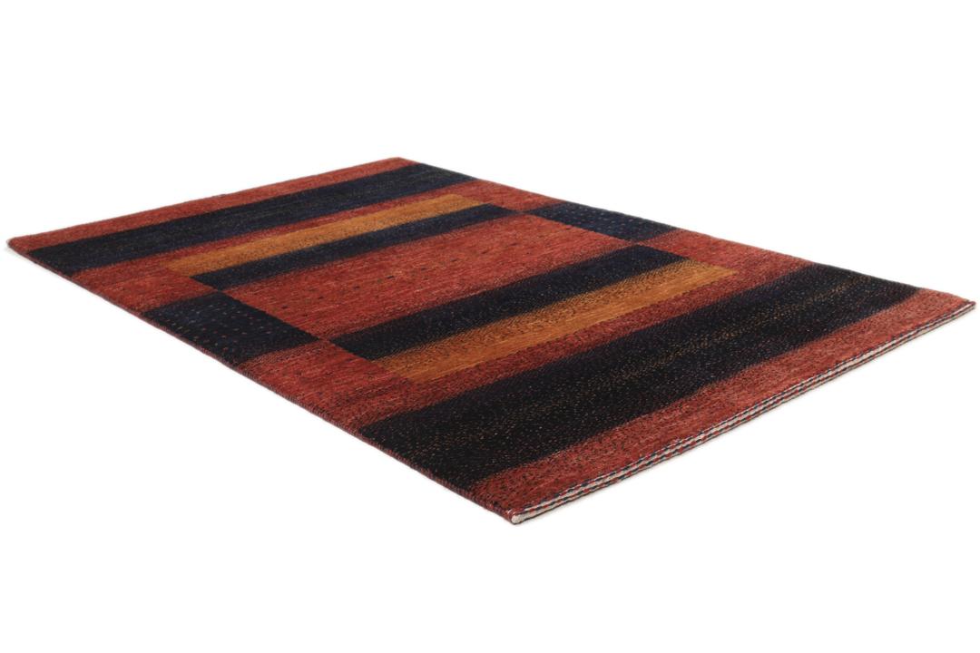 Hand-knotted Loribaft wool rug from the Middle East in red, orange, and blue.