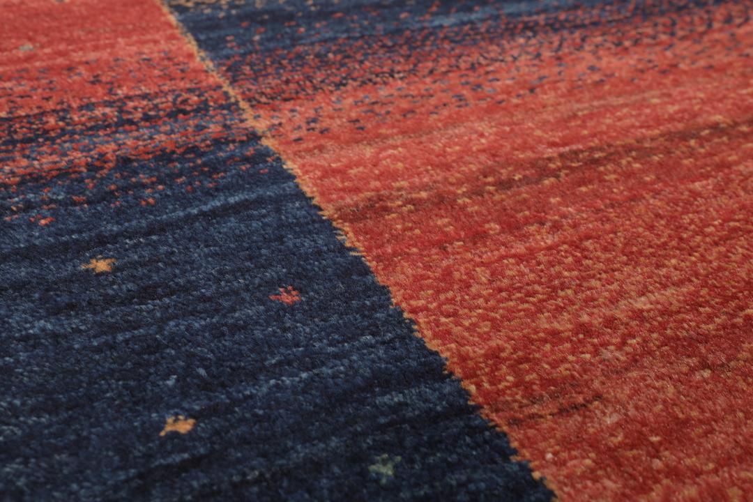 Handgeknoopt kleed uit het Midden-Oosten in donkerrode en blauwe tinten