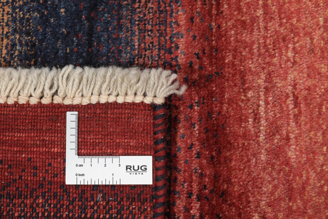Handgeknoopt kleed uit het Midden-Oosten in donkerrode en blauwe tinten