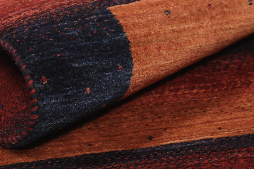 Hand-knotted Loribaft Fine wool rug from the Middle East in dark-red and black tones