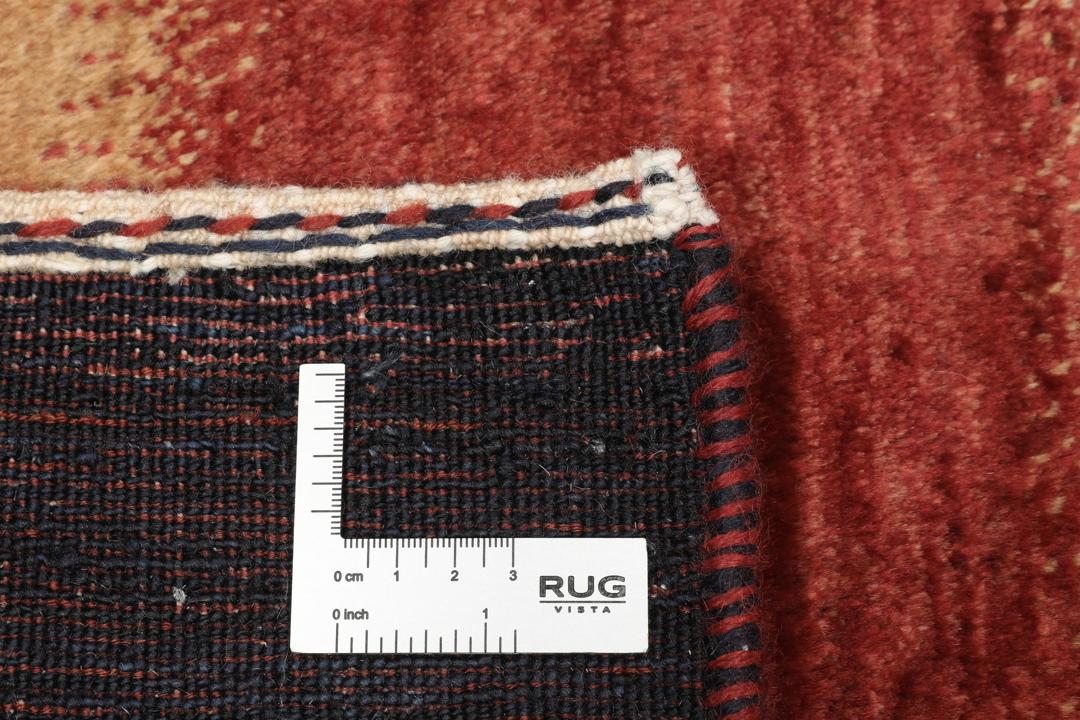 Håndknyttet mellemøstligt tæppe med stribet mønster i rød, brun og sort