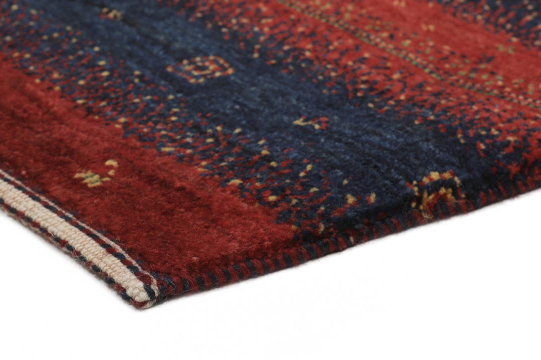 Hand-knotted Loribaft Fine rug from the Middle East in red and dark blue colours.