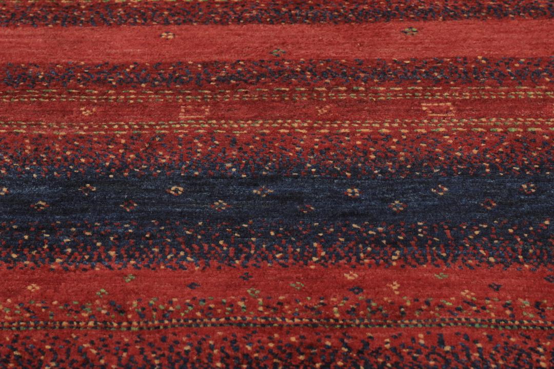 Hand-knotted Loribaft Fine rug from the Middle East in red and dark blue colours.