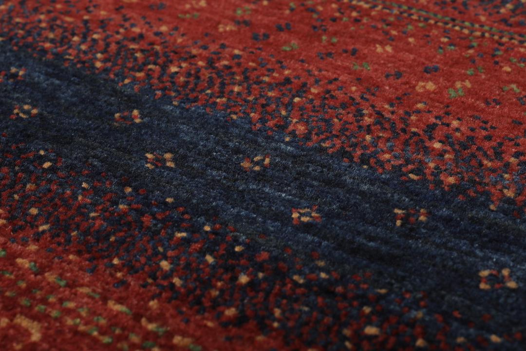 Hand-knotted Loribaft Fine rug from the Middle East in red and dark blue colours.