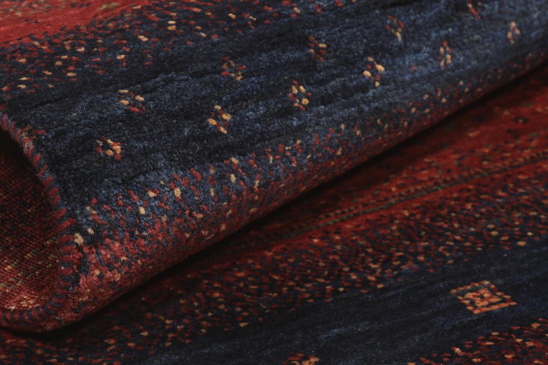 Hand-knotted Loribaft Fine rug from the Middle East in red and dark blue colours.