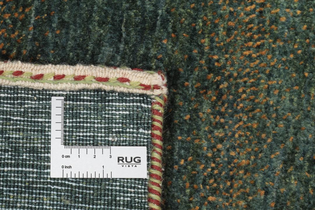 Håndknyttet Loribaft Fine-tæppe fra Mellemøsten i mørkegrøn og brun.
