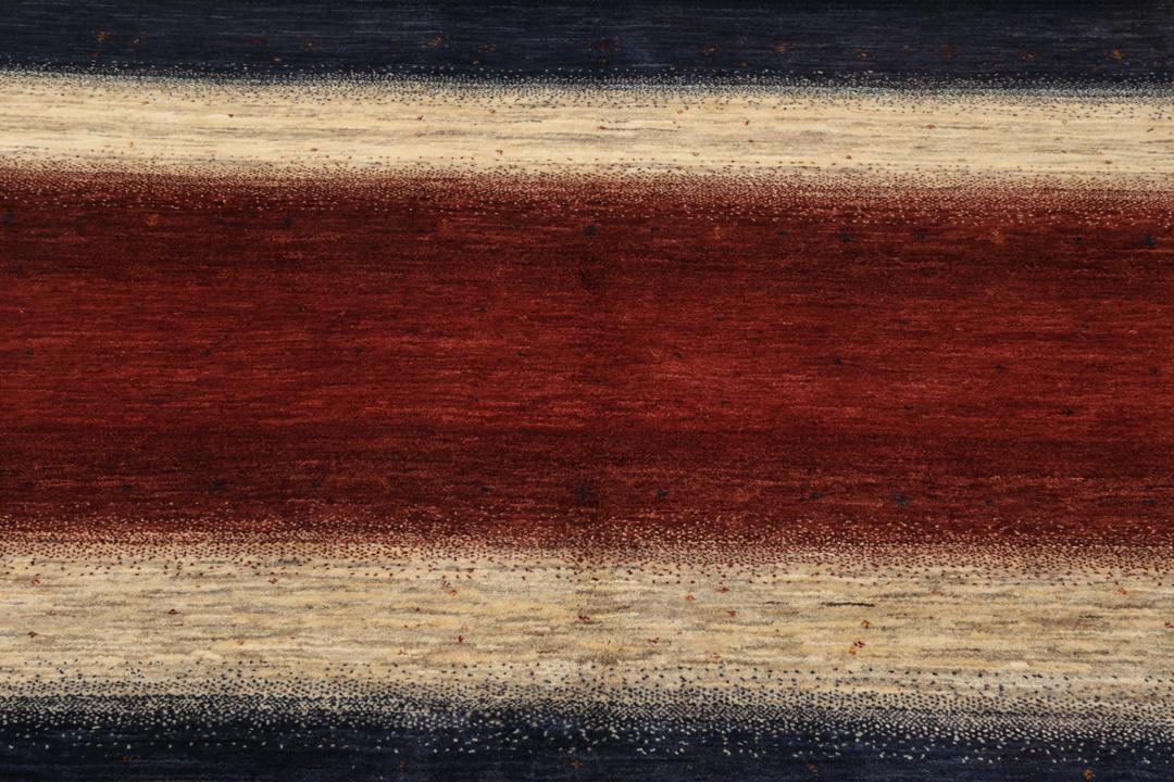 Hand-knotted Loribaft rug from the Middle East with a striped red, blue, and cream design