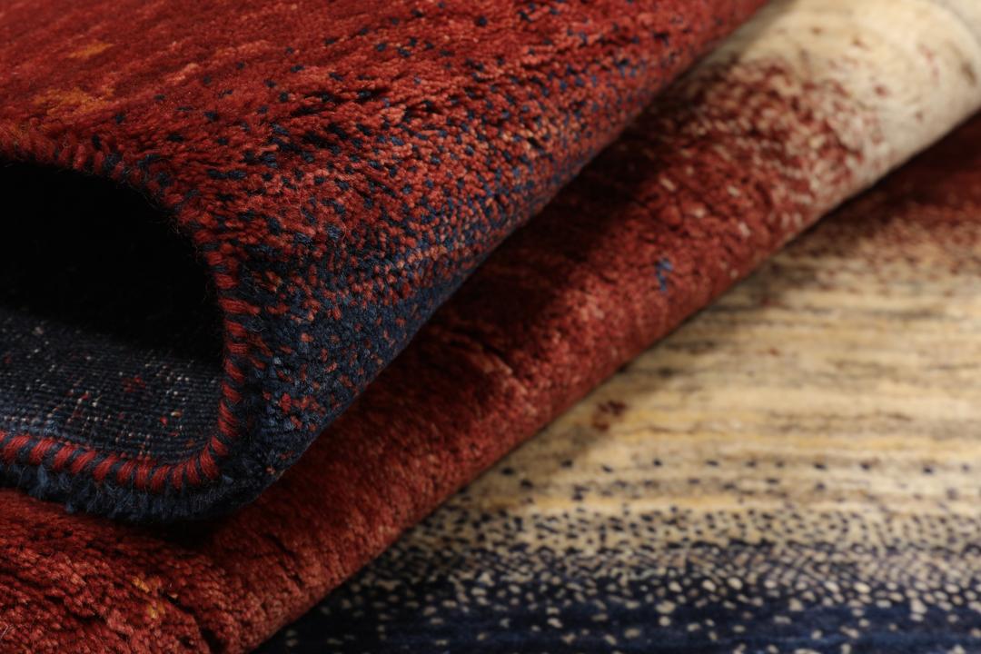 Hand-knotted Loribaft rug from the Middle East with a striped red, blue, and cream design