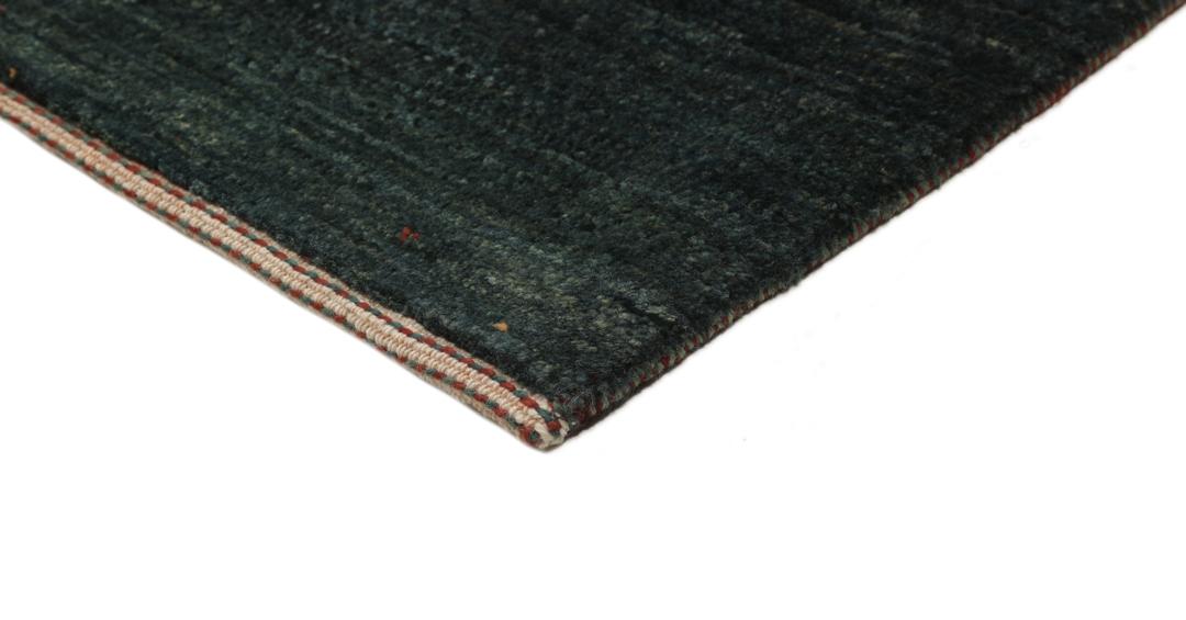Hand-knotted Loribaft Fine rug from the Middle East in dark-green.