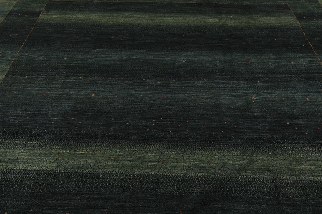 Hand-knotted Loribaft Fine rug from the Middle East in dark-green.